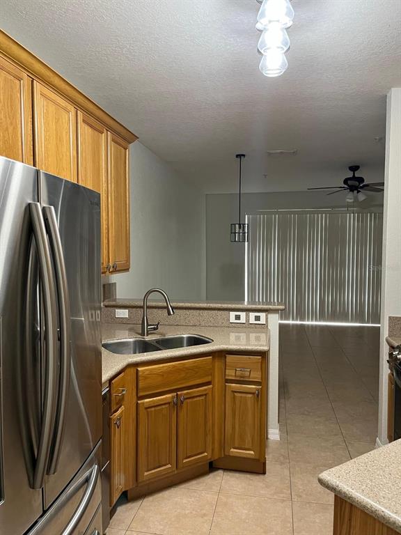 a kitchen with a sink appliances and cabinets