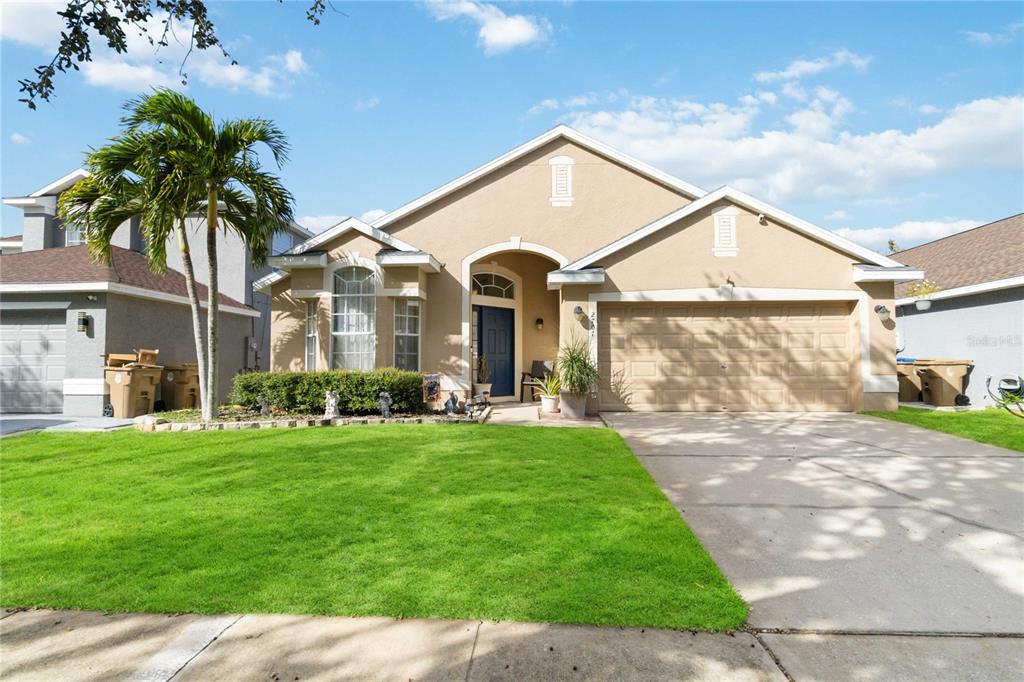 a front view of a house with a yard