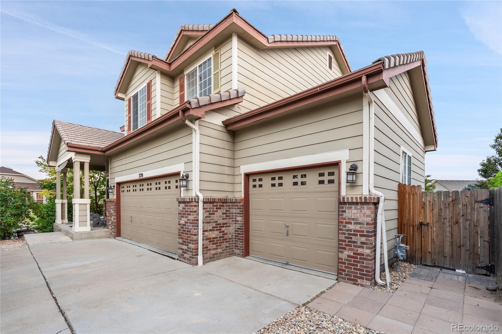 a view of front of house with wooden fence