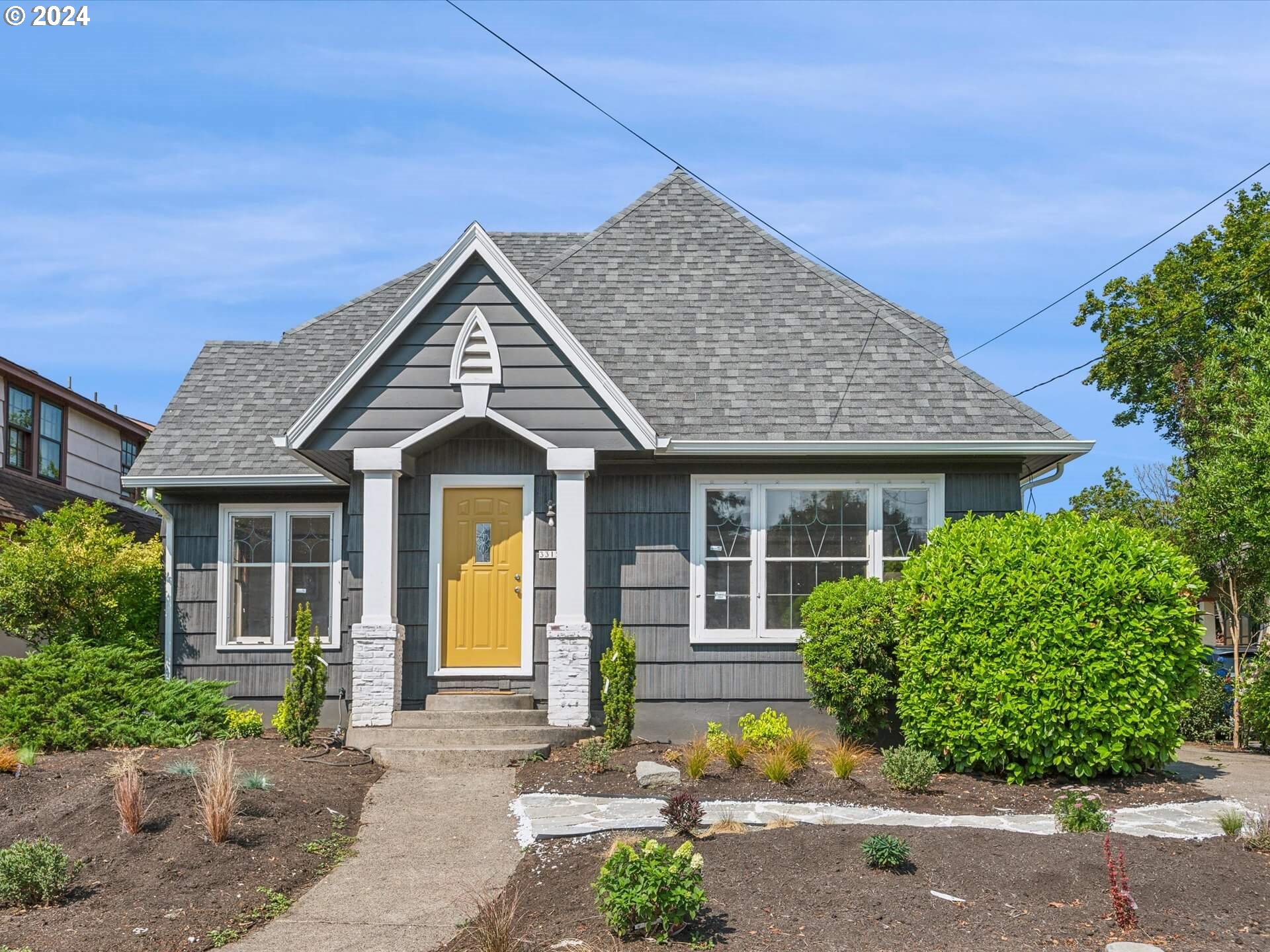 a front view of a house with a yard