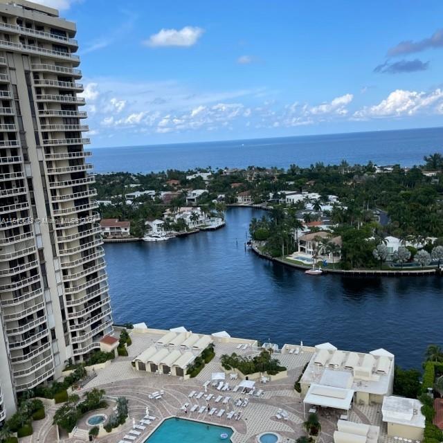 a view of a lake with a city skyline in the background