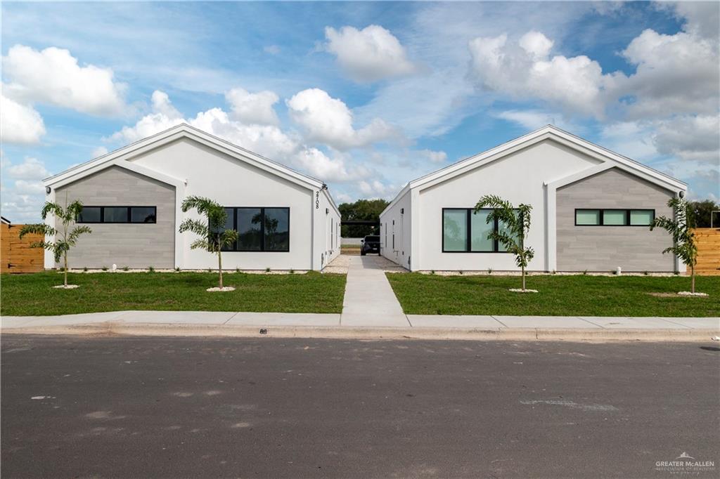 a view of road and front view of a house