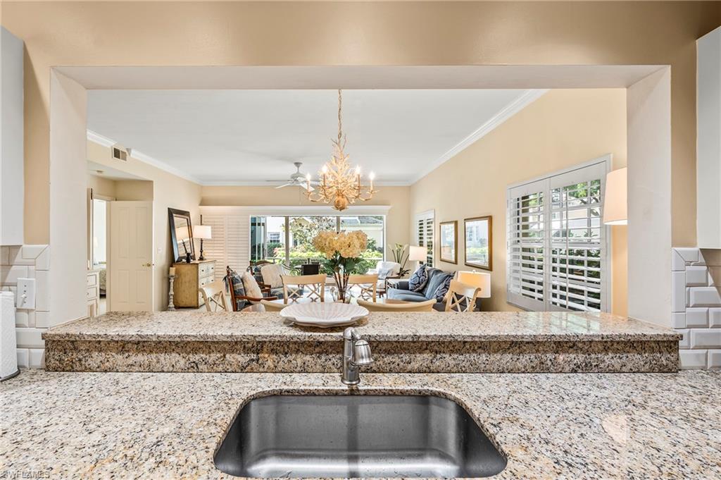 a view of a living room and chandelier