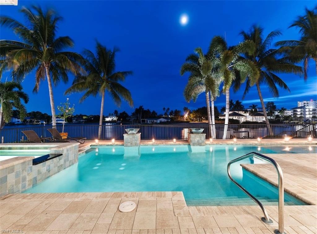 a view of swimming pool with outdoor seating