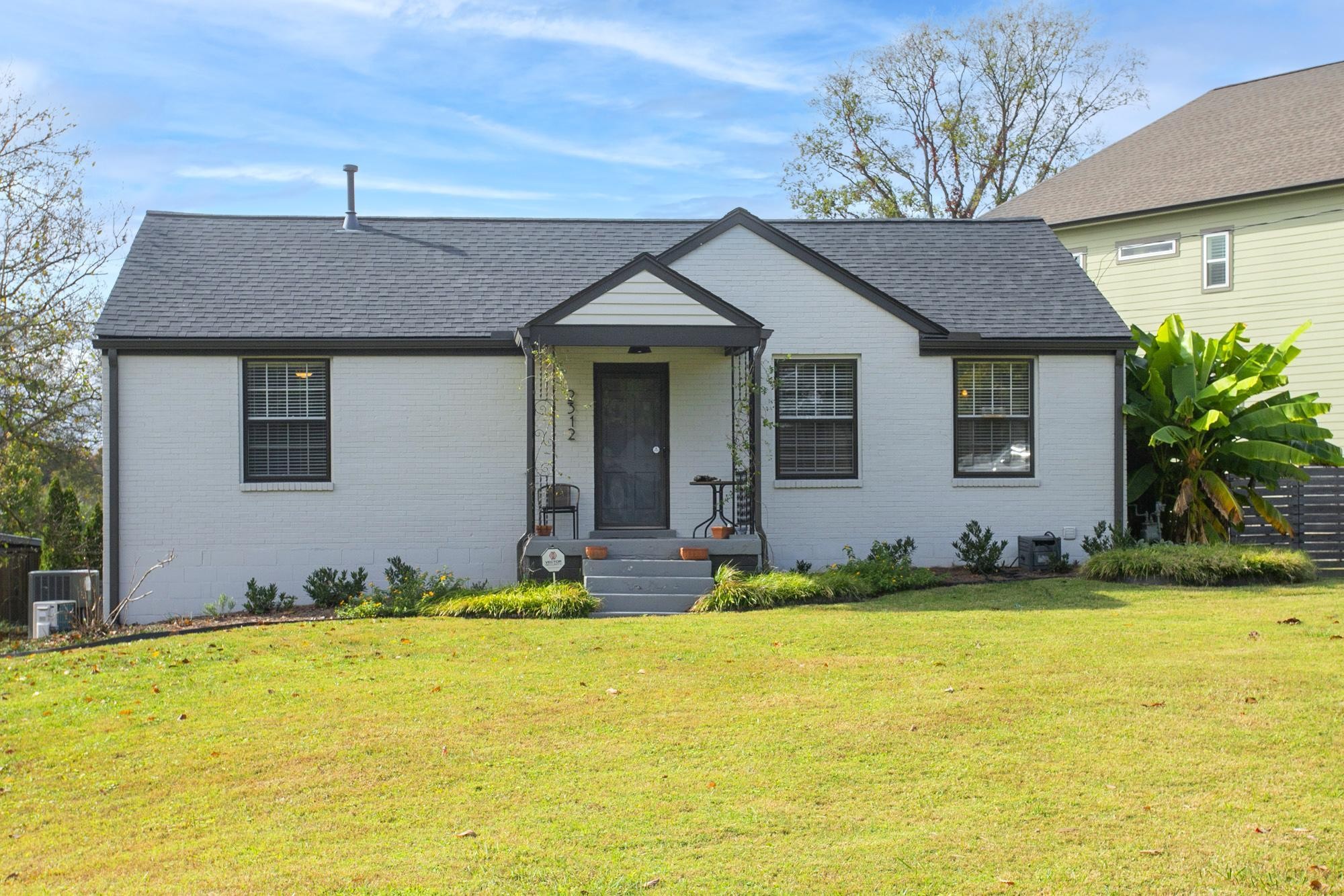 a front view of a house with yard