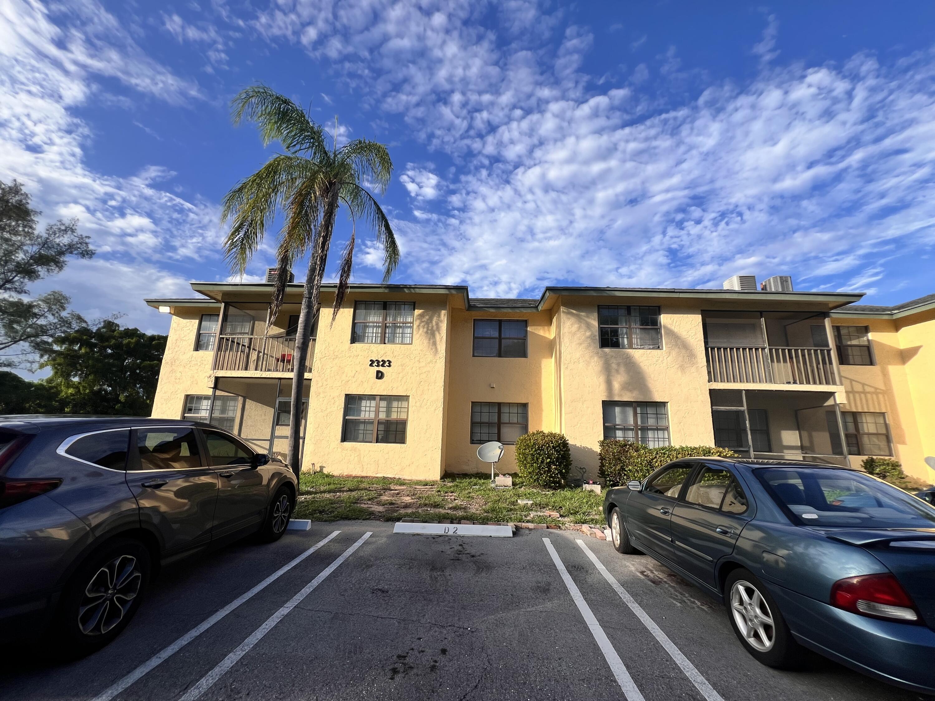 a front view of a house with parking space