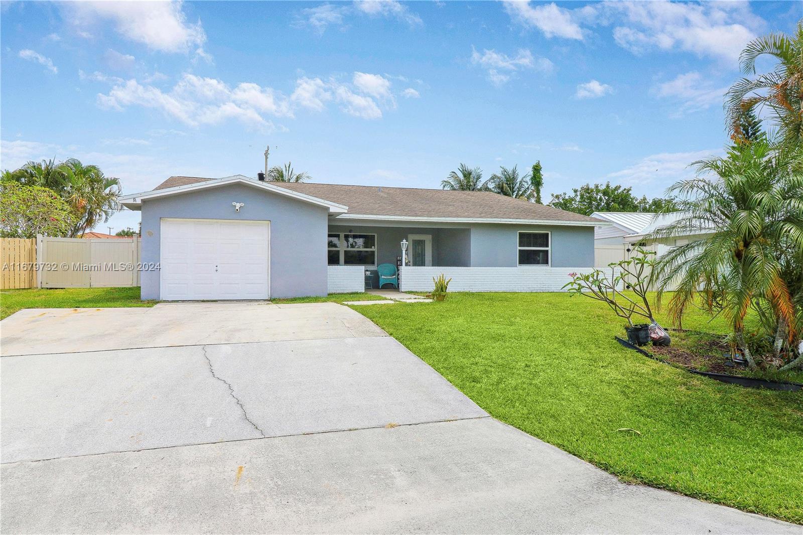 a view of house with a yard