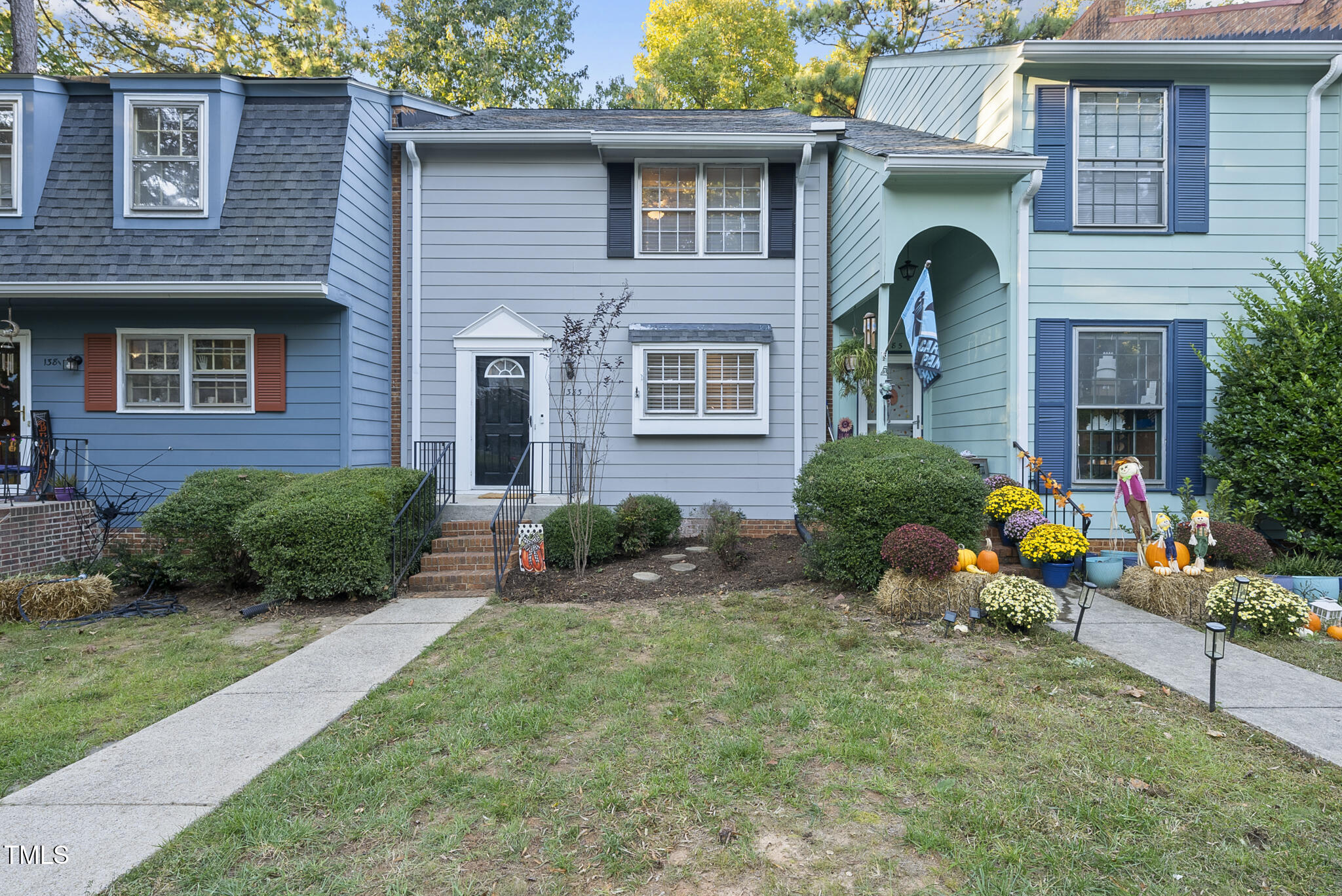 a front view of a house with an outdoor seating