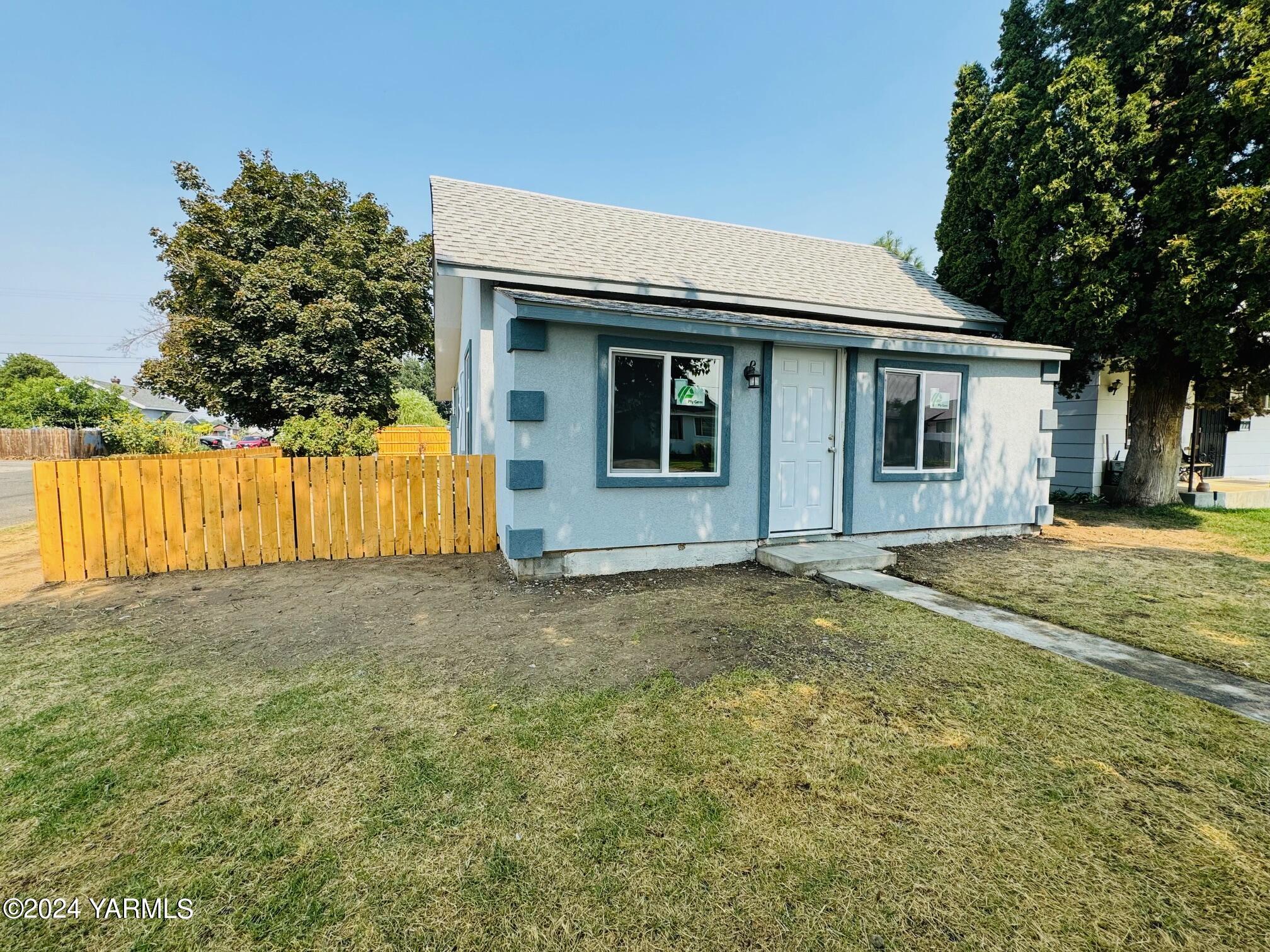 front view of a house with a yard