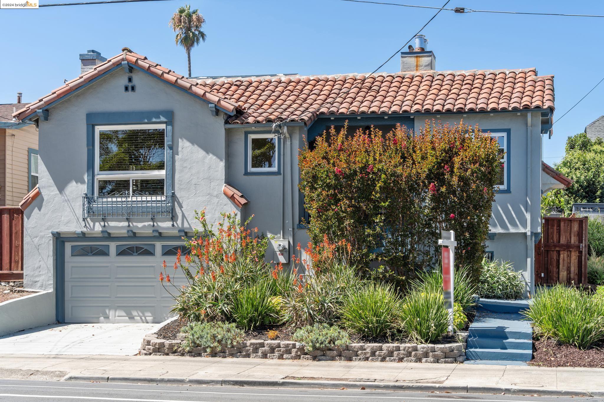 a front view of a house with garden