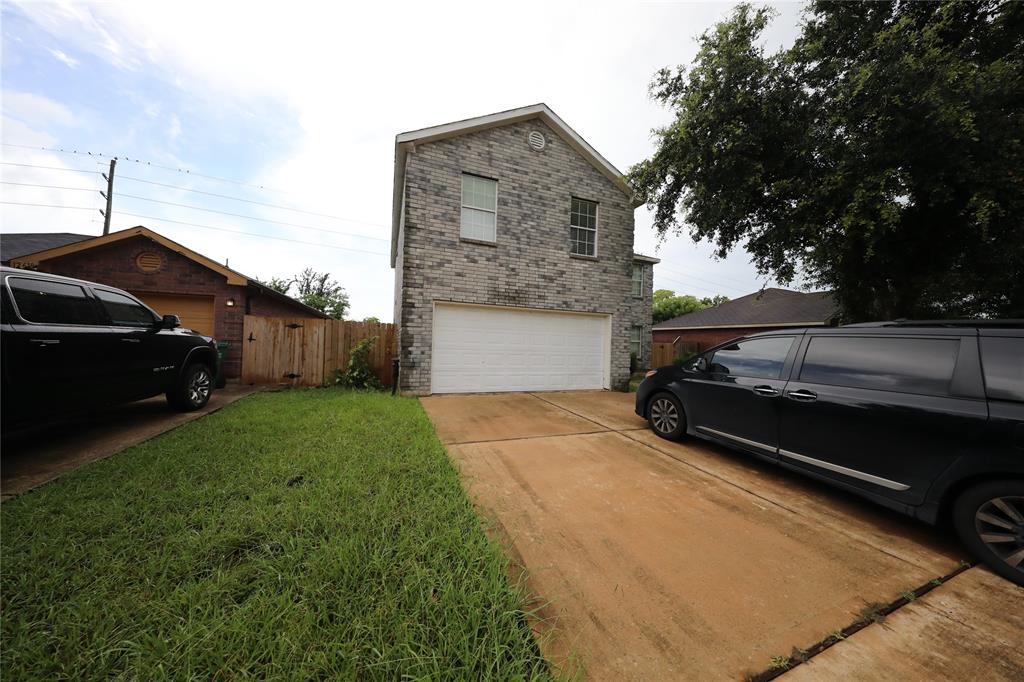 a view of a car parked in front of a house