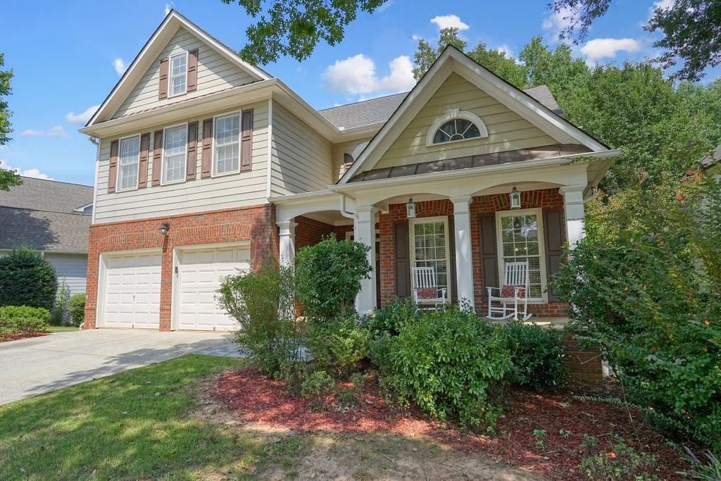 front view of a house with a yard