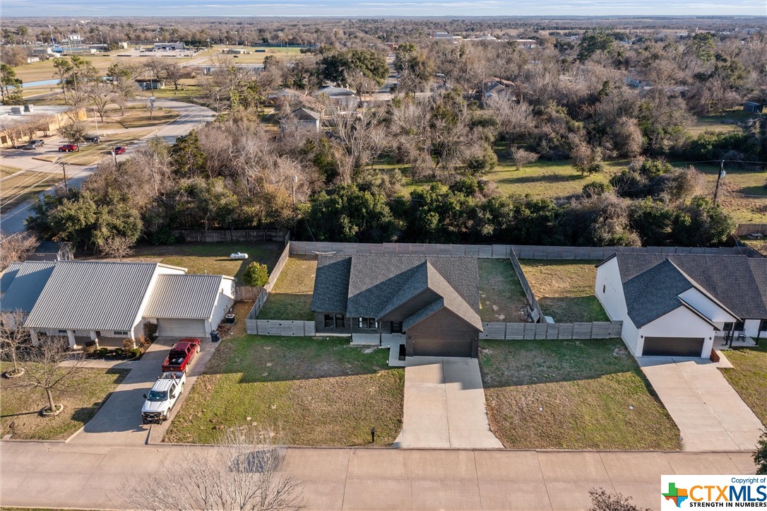 an aerial view of house with yard