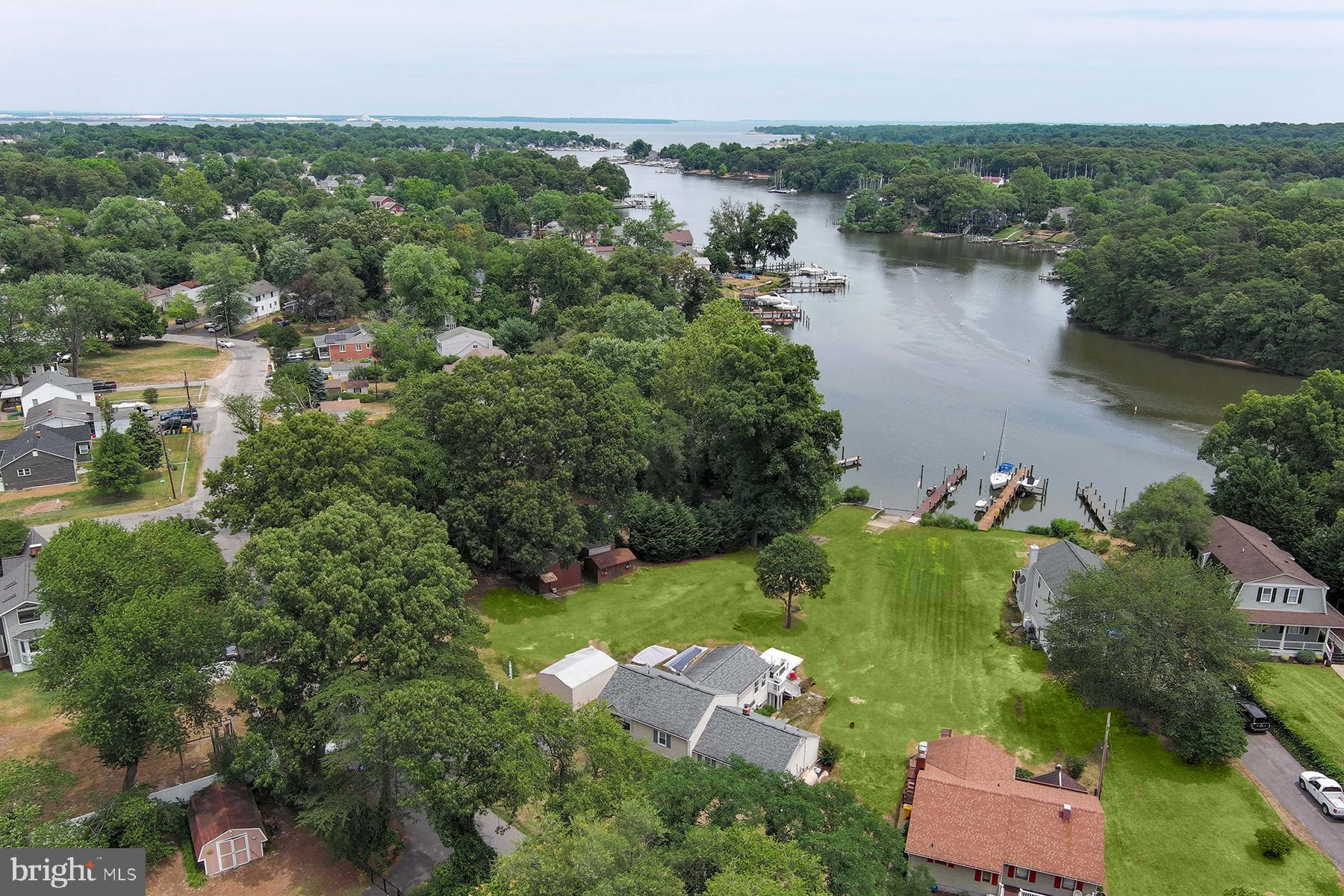 an aerial view of a house with a lake view