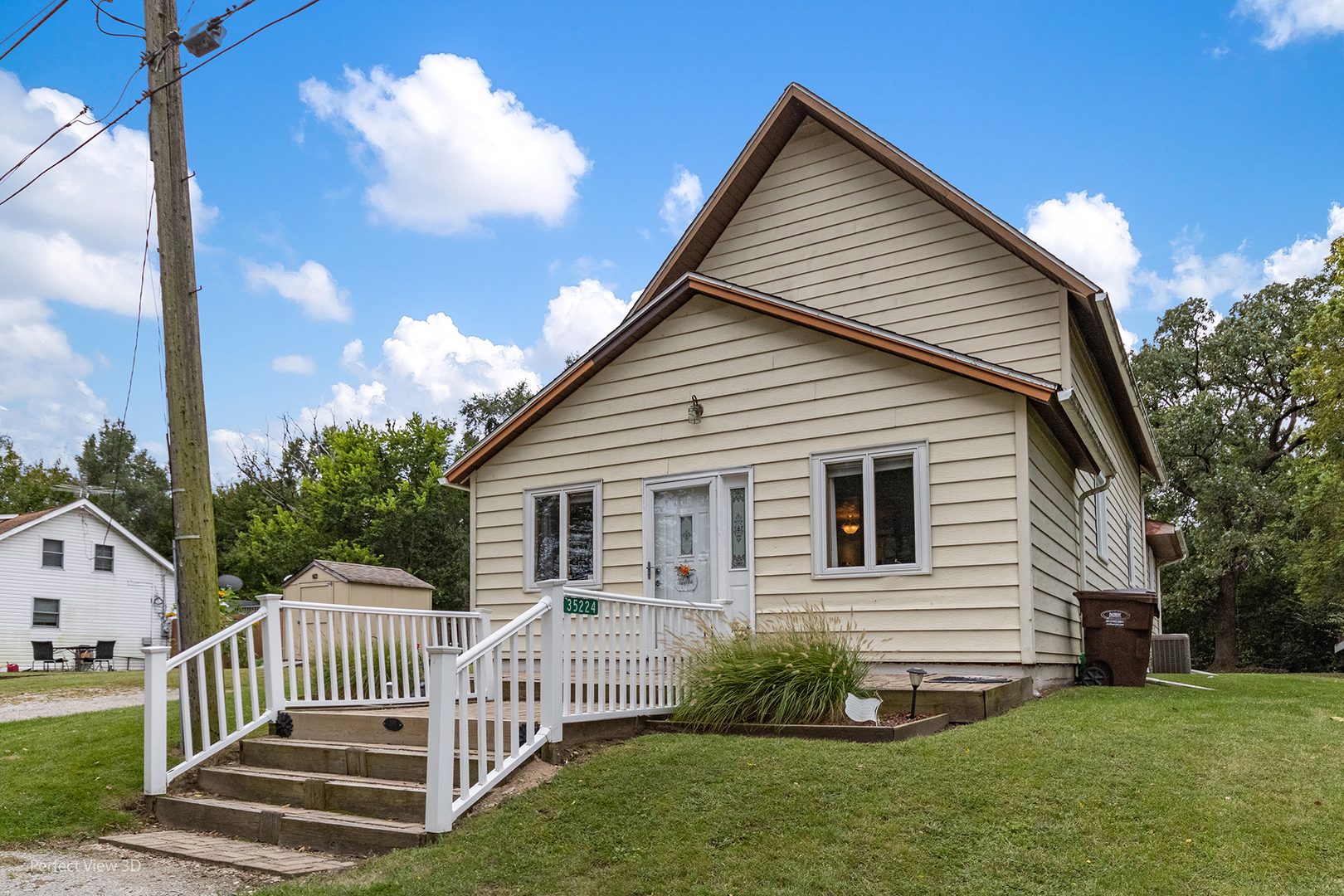 a view of a house with a yard