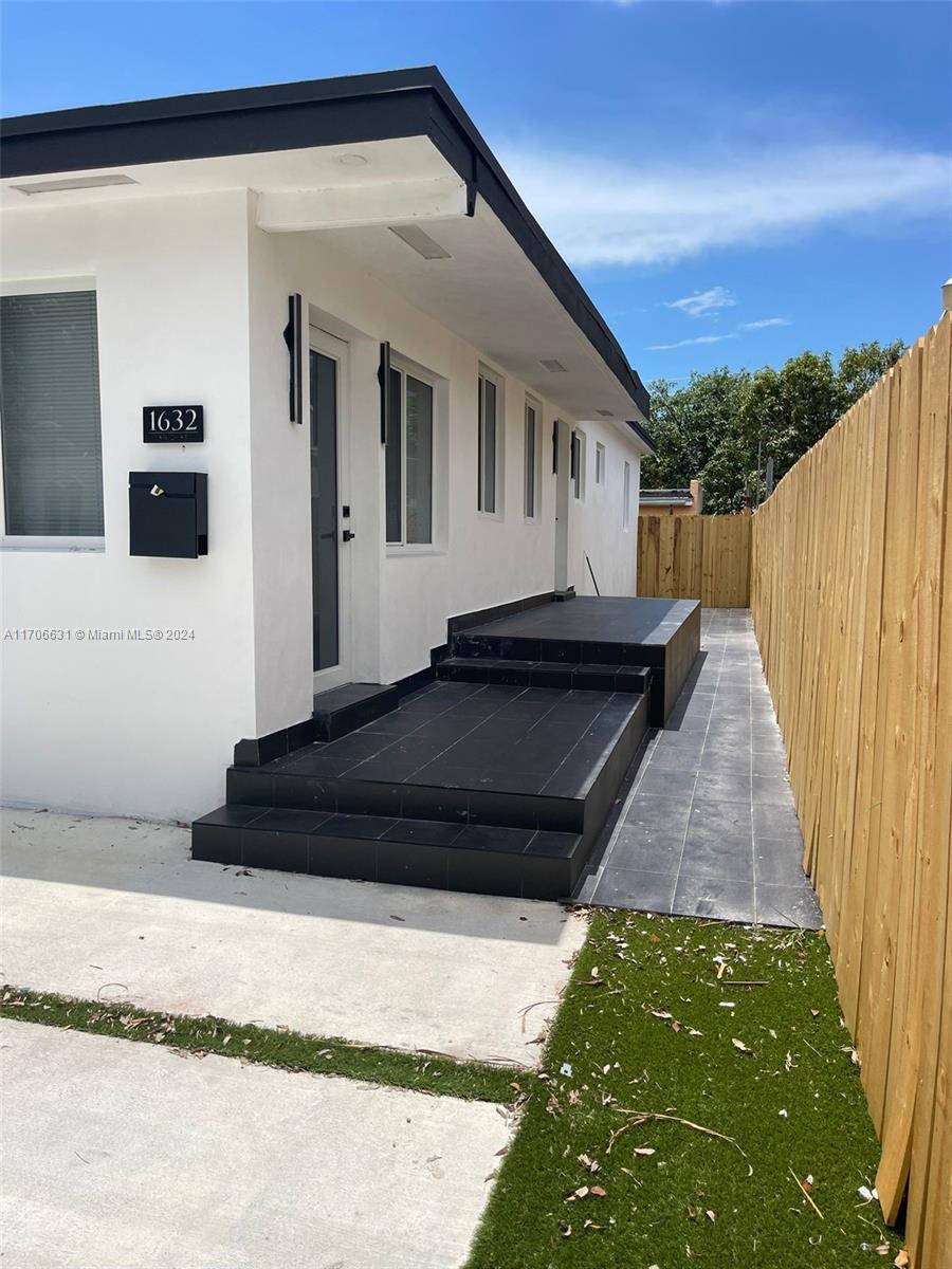 a black and white house with outdoor space