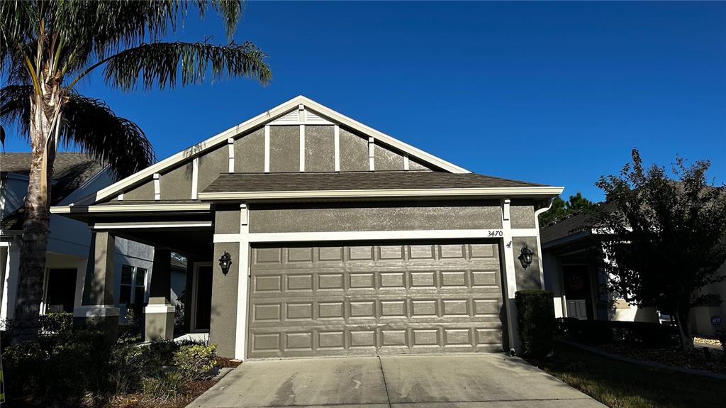 a front view of a house with garage