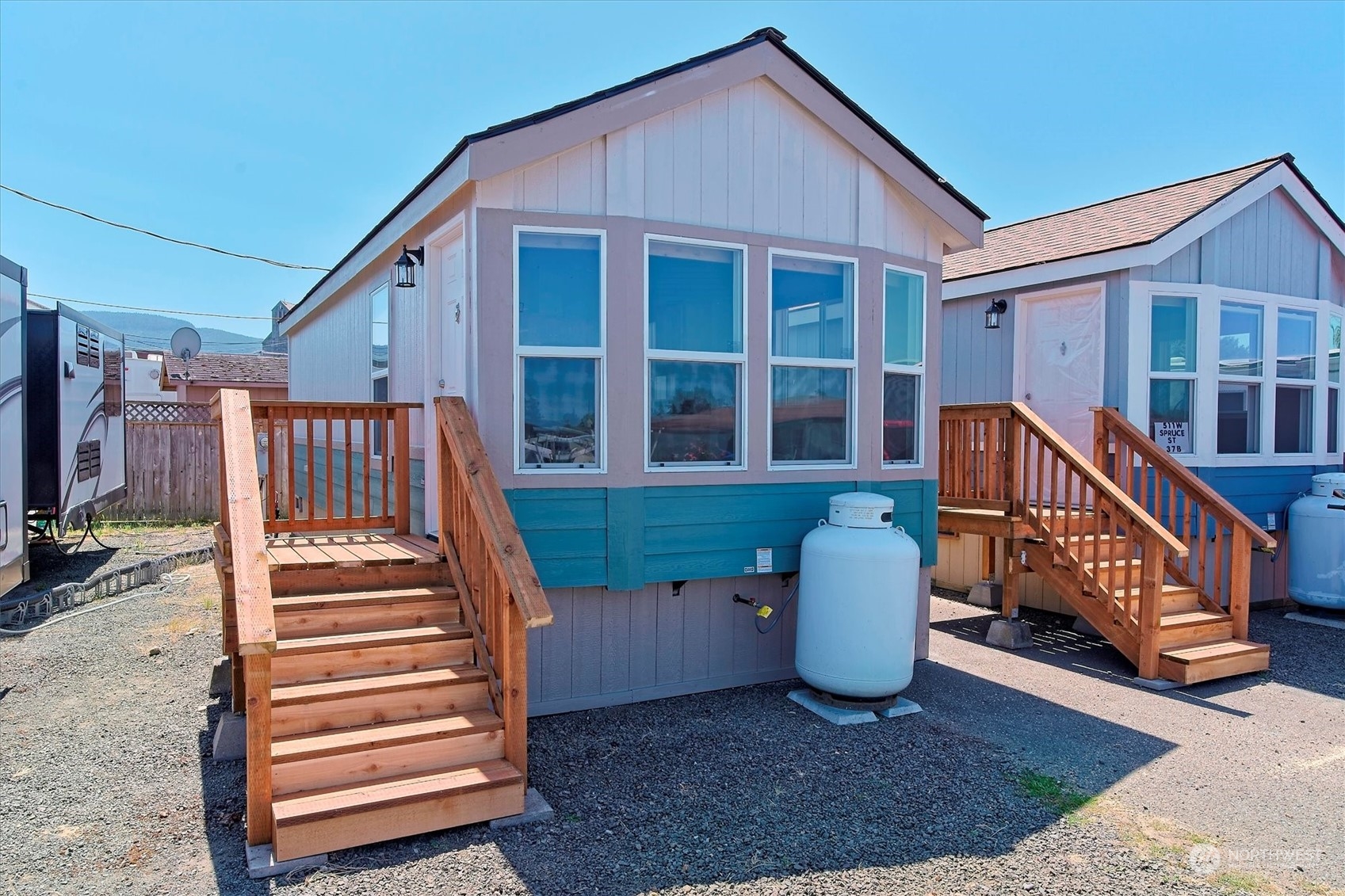 a view of a house with a small deck