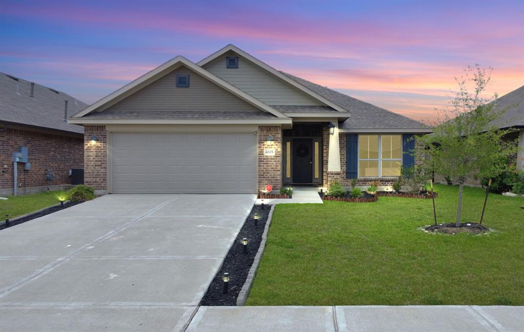 a front view of house with yard and outdoor seating