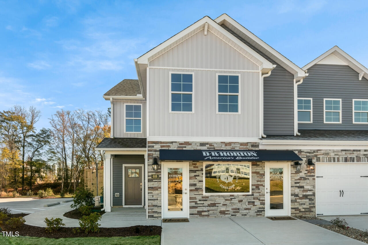 a front view of a house with a garage