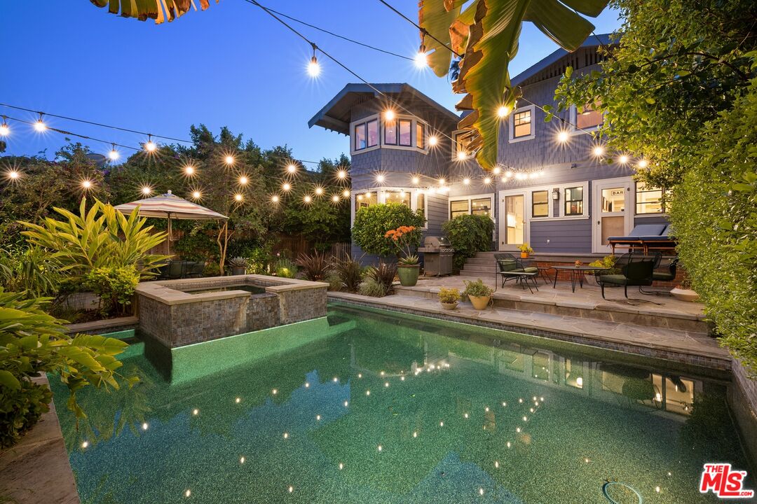 a view of a swimming pool with a patio