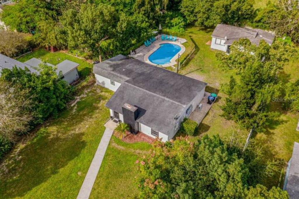 an aerial view of a house with a swimming pool