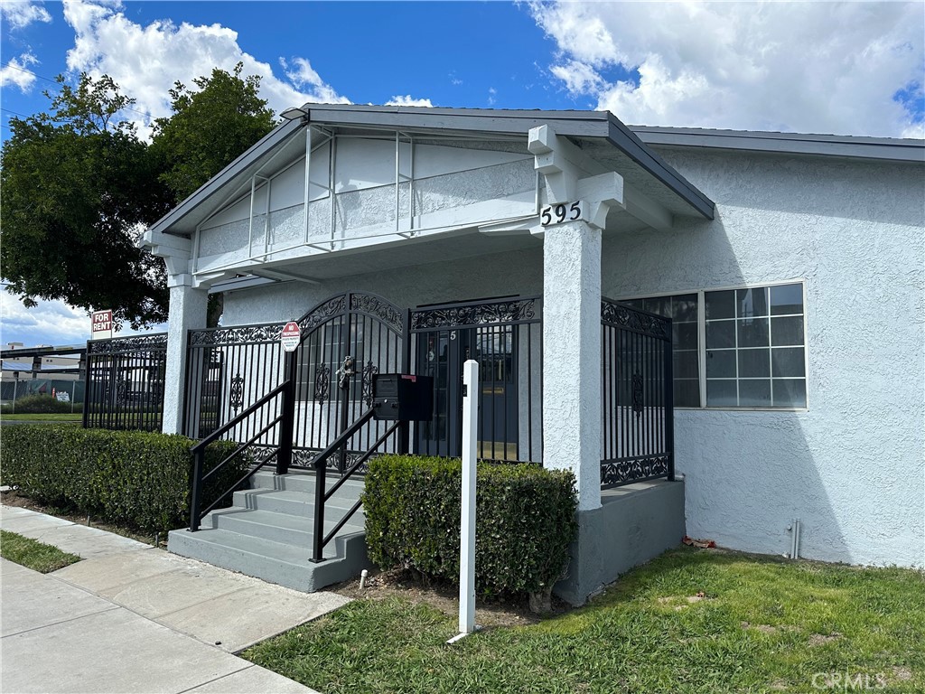 a front view of a house with garden