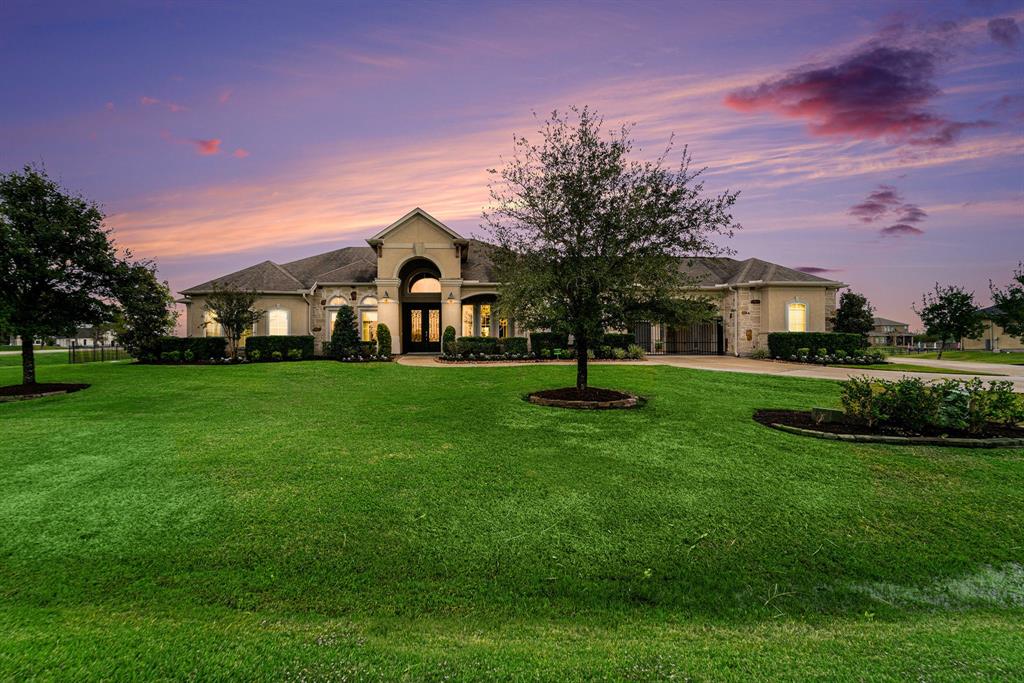 This beautiful one story home sitting on one+ acre welcomes you home!  The stucco and stone facade are a true show stopper, along with full gutters and mature trees. The upgraded landscaping and manicured lawn are just the beginning of the multiple exterior upgrades this home has to offer