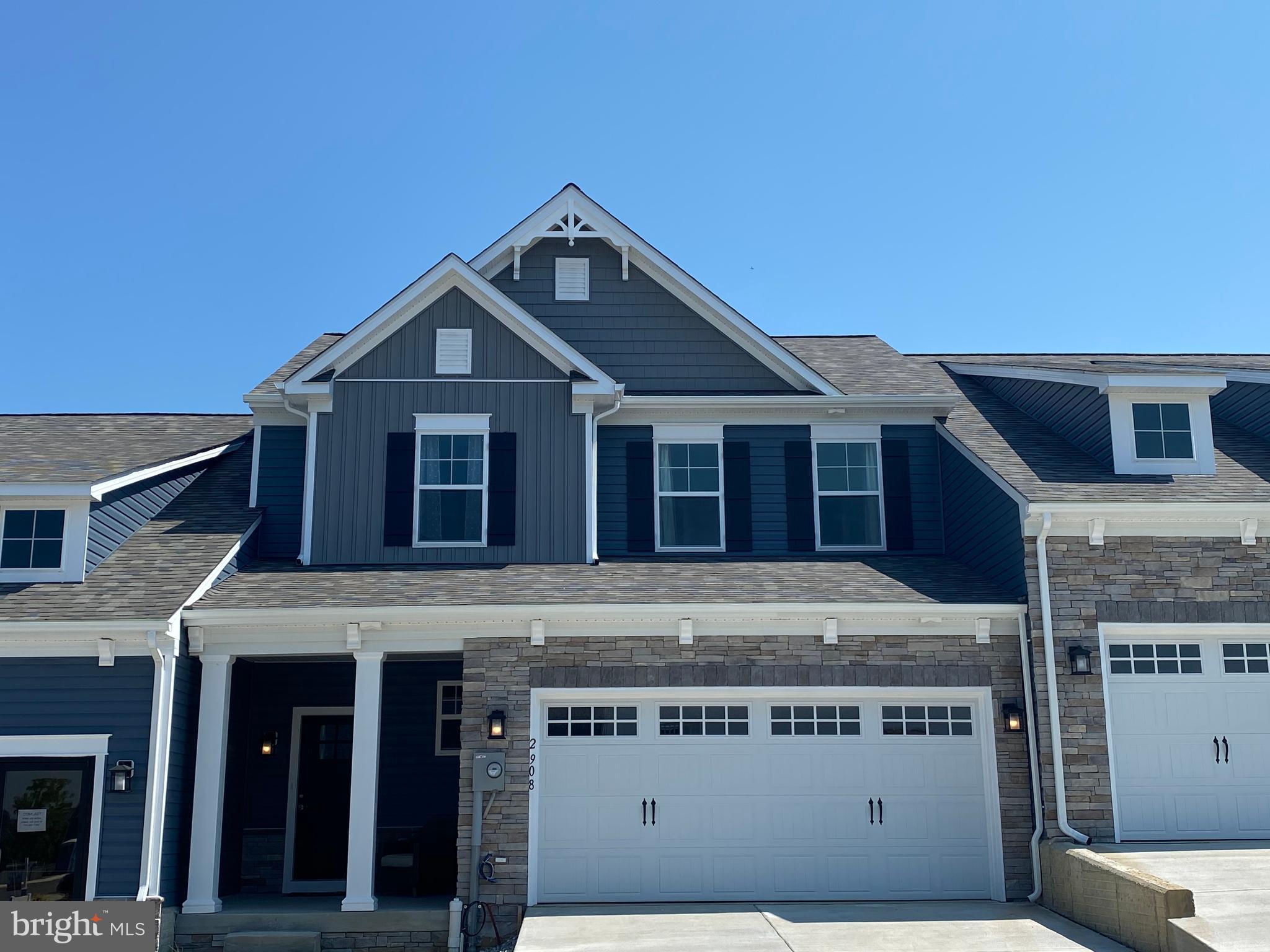 a front view of a house with a garage