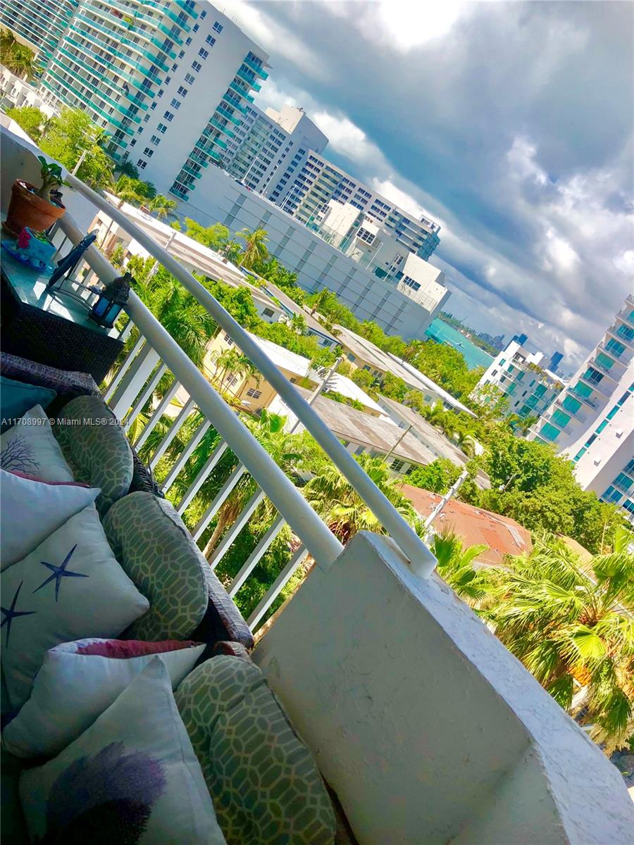 a view of swimming pool from a balcony