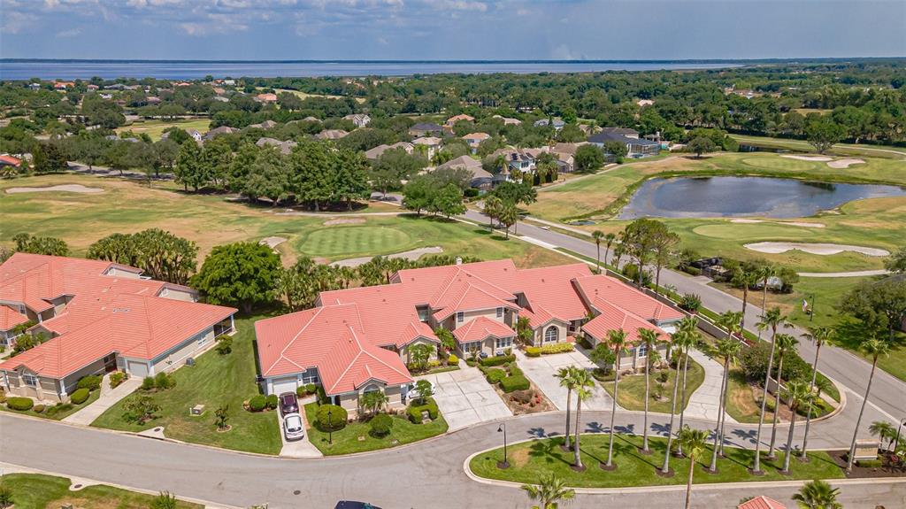 an aerial view of residential houses with outdoor space and street view