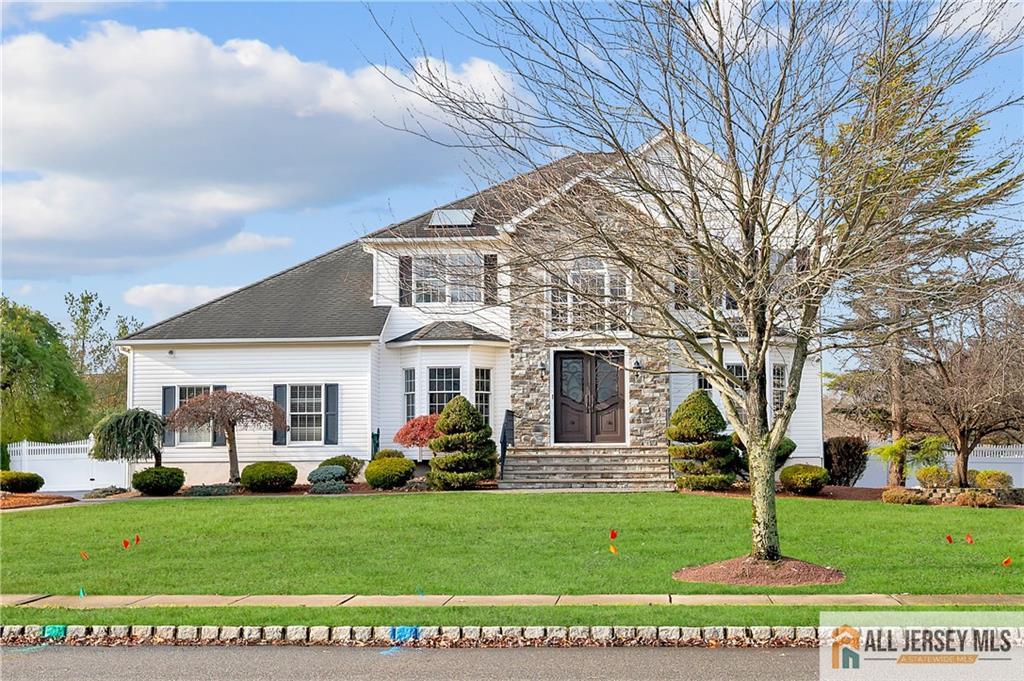 a front view of a house with a yard