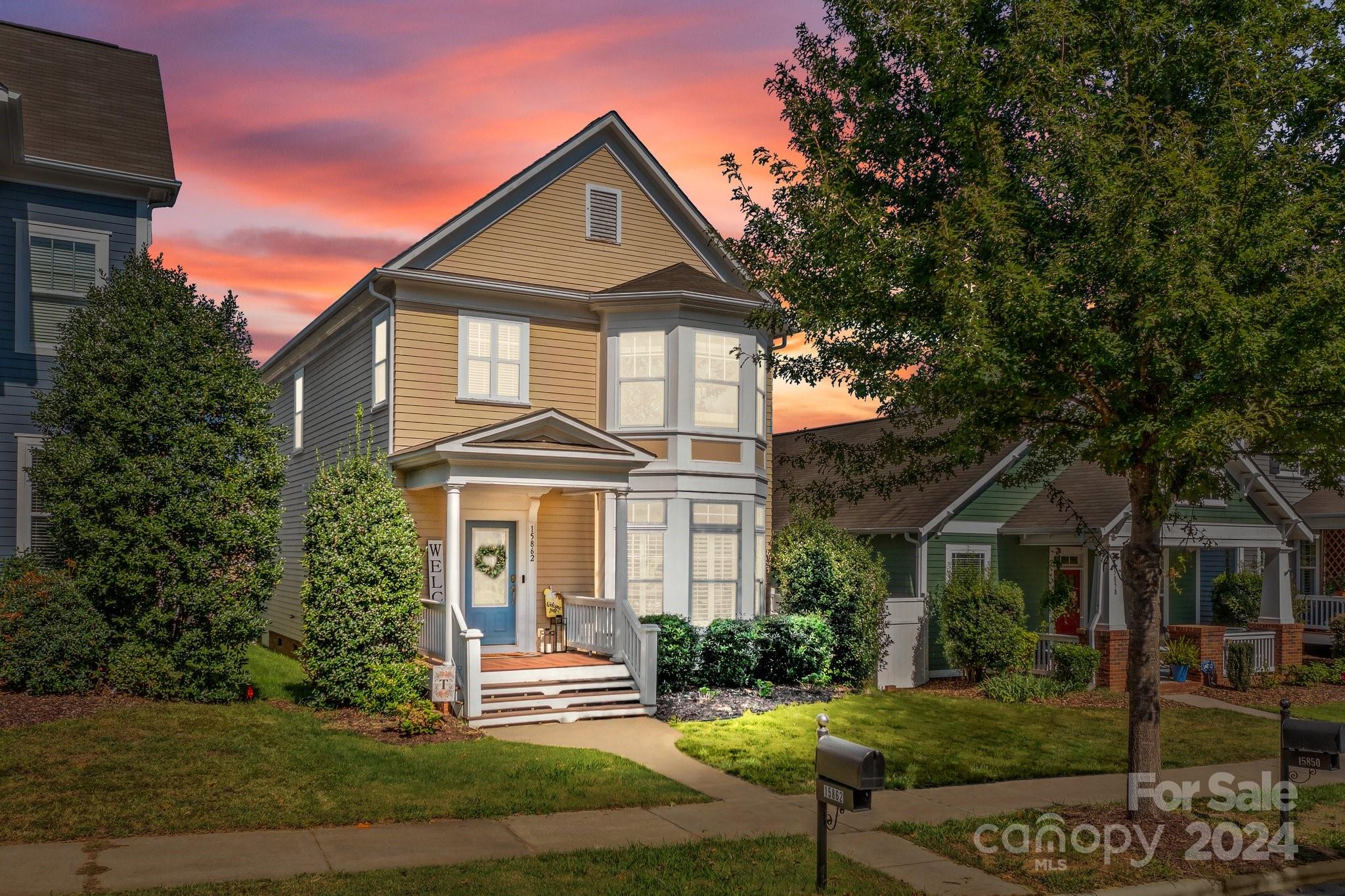 a front view of a house with a yard