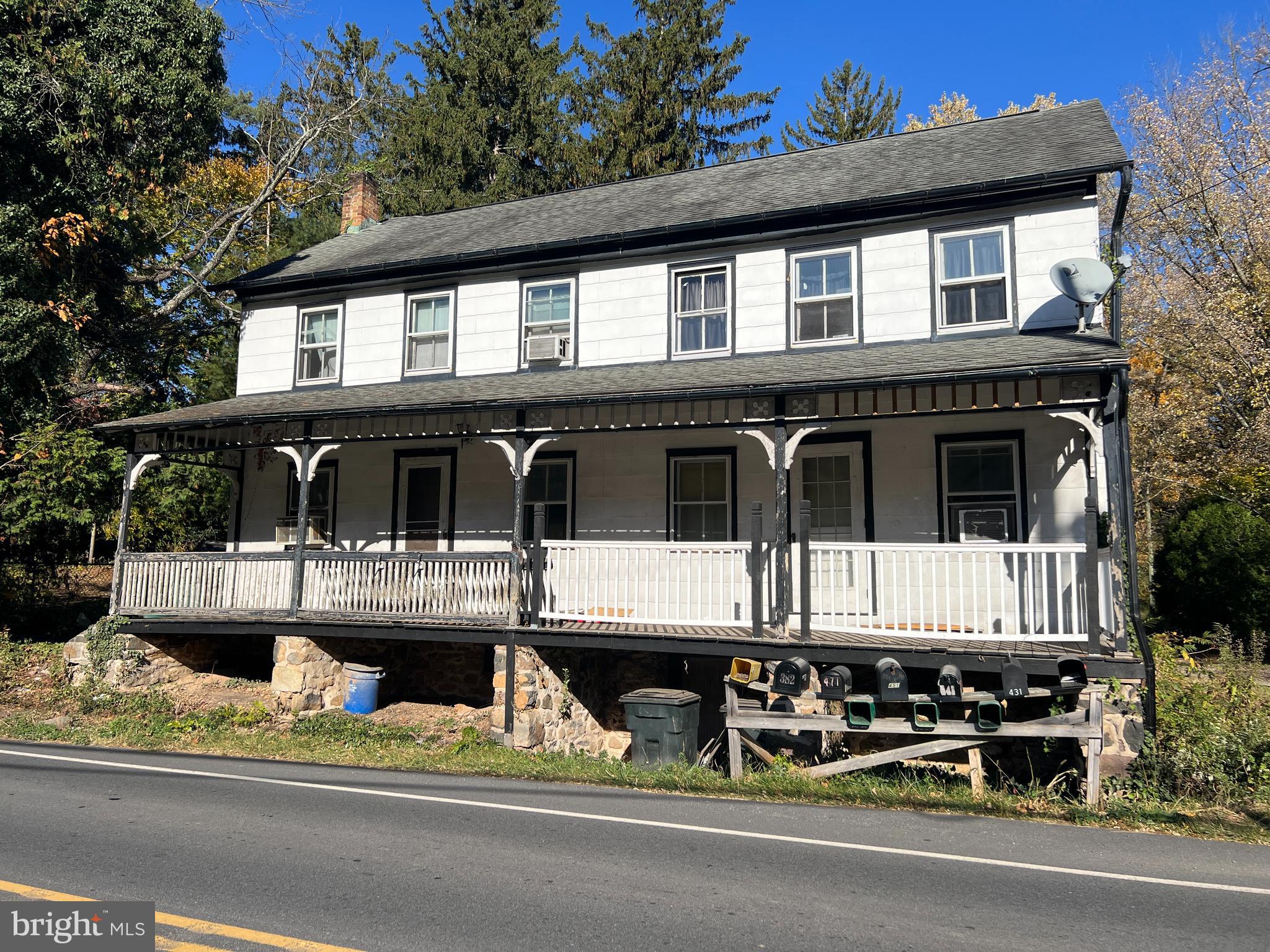 a front view of a house with a porch