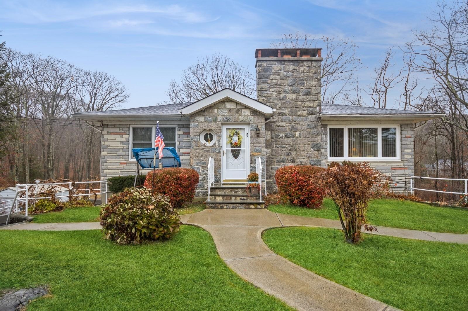 View of front of property with a front yard