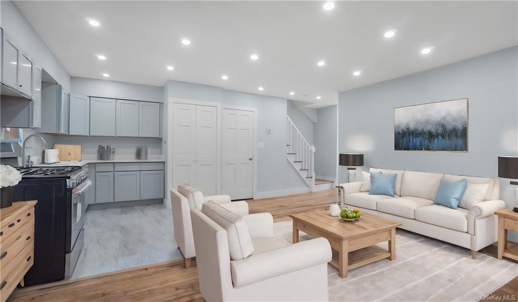 Living room with light wood-type flooring