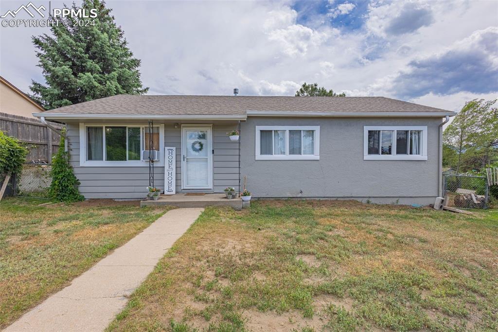 front view of a house with a yard