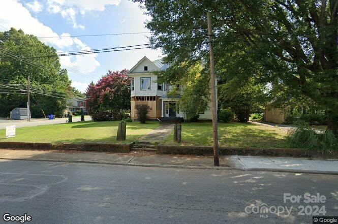 a view of a house with a big yard