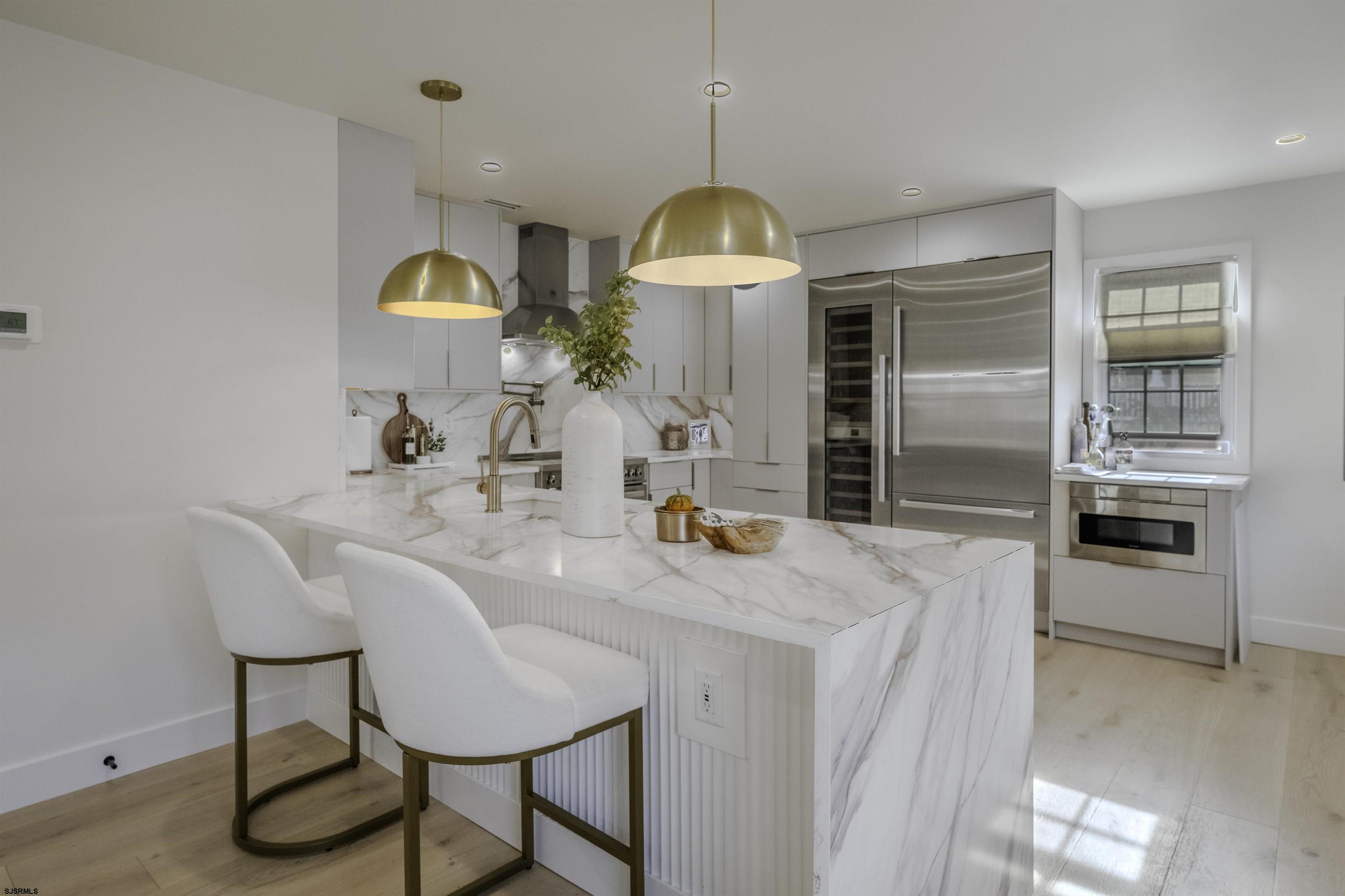 a kitchen with a table and chairs in it