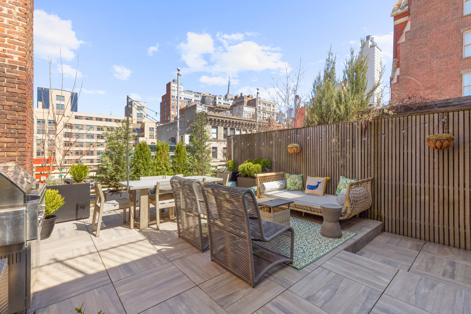 a view of a patio with couches and potted plants