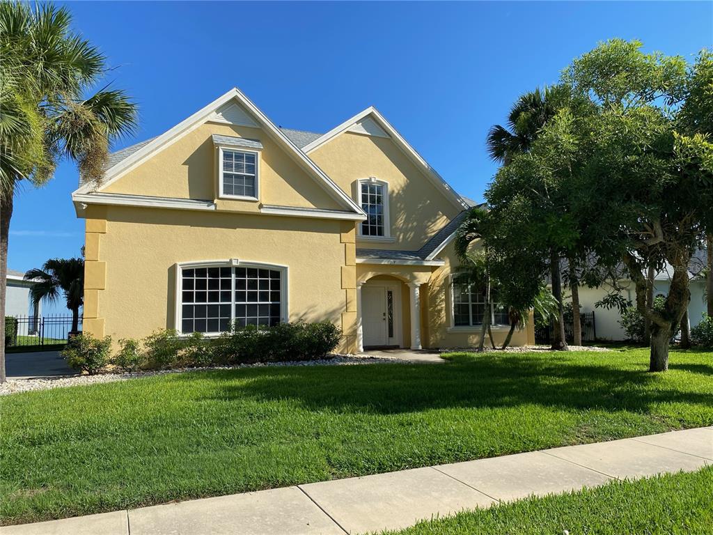 a front view of a house with a yard