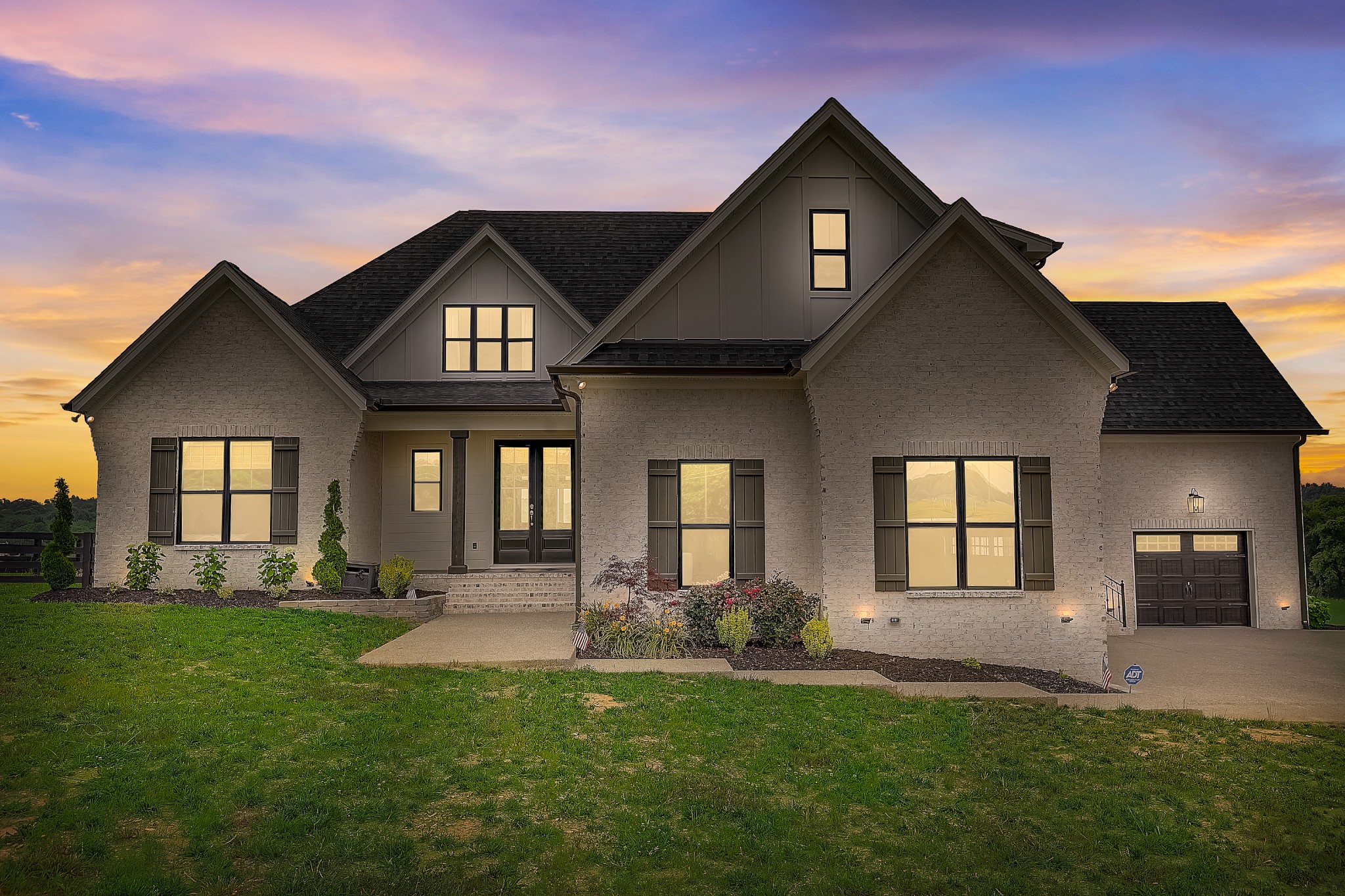 a front view of a house with a yard