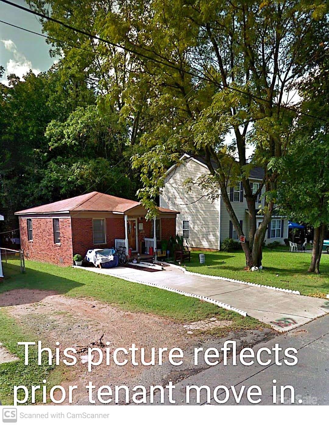 a view of a sign board with a big yard