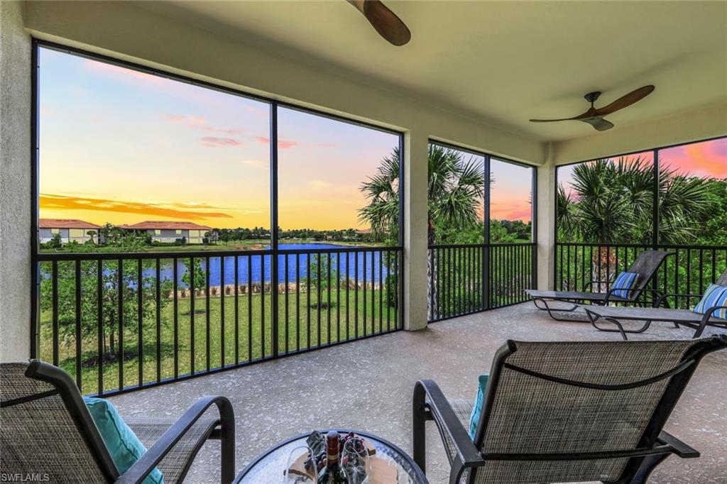 a balcony with furniture and city view