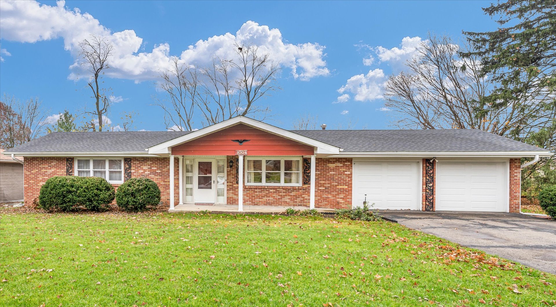 front view of a house with a yard