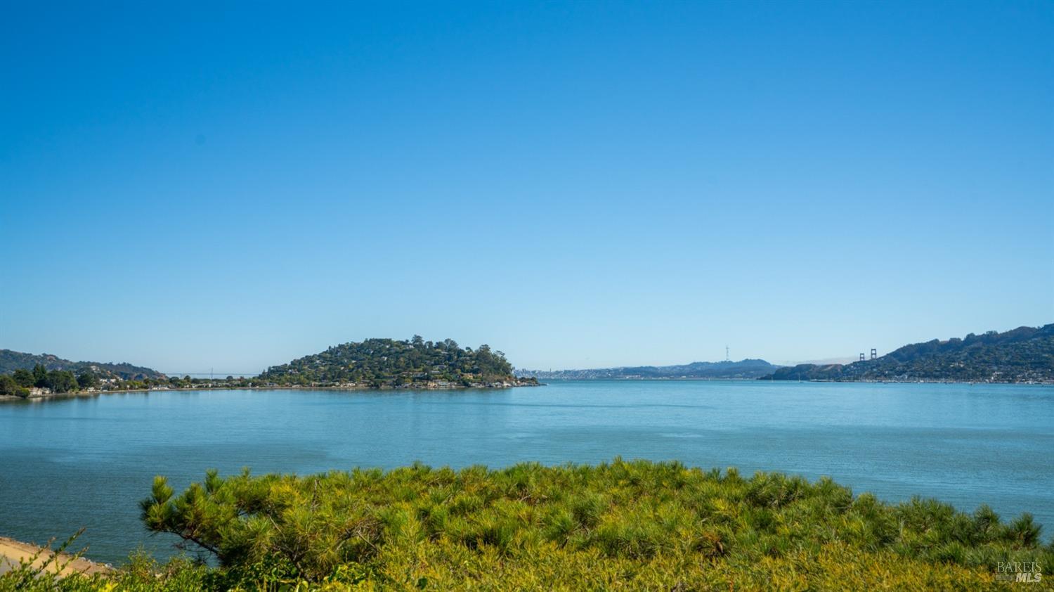 a view of lake with mountain in the background