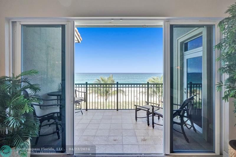 a view of a balcony with furniture