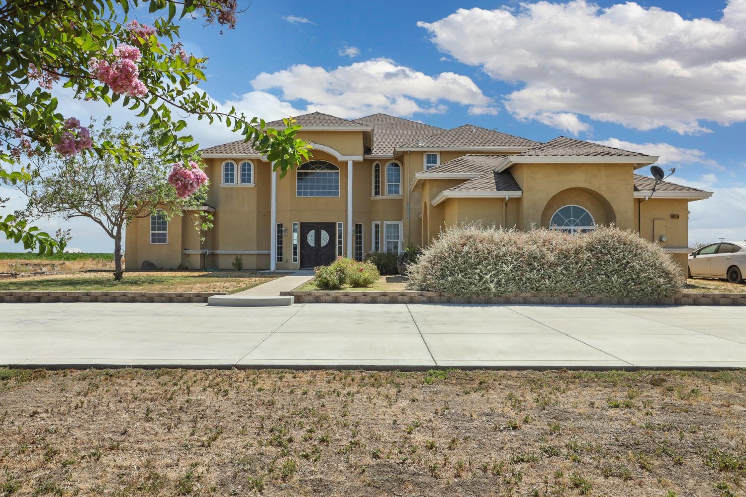 a front view of a house with yard