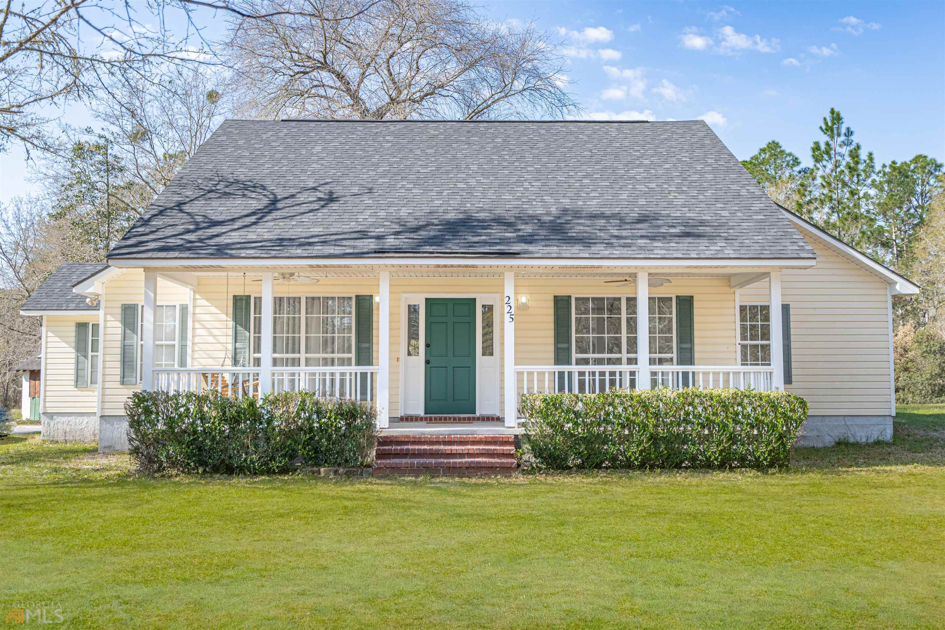 a view of a house with a garden