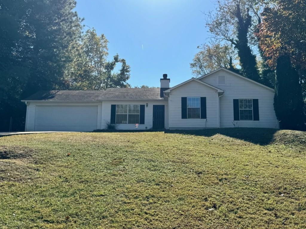 a house with yard in front of it